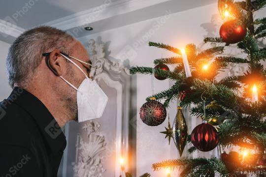 Caucasian Senior man wearing covid-19 mask in Christmas decorated room .   : Stock Photo or Stock Video Download rcfotostock photos, images and assets rcfotostock | RC Photo Stock.: