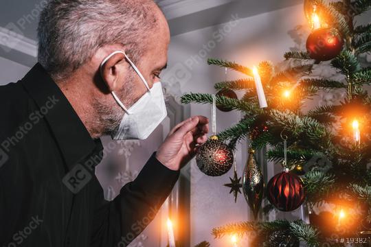 Caucasian Senior man wearing covid-19 mask in Christmas decorated room .   : Stock Photo or Stock Video Download rcfotostock photos, images and assets rcfotostock | RC Photo Stock.: