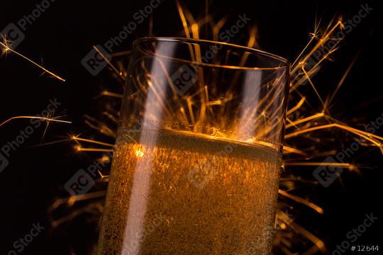 champagne glass with Ignited Sparkler   : Stock Photo or Stock Video Download rcfotostock photos, images and assets rcfotostock | RC Photo Stock.: