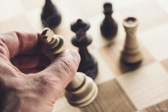 Chess game player makes a move the white king wins the game  : Stock Photo or Stock Video Download rcfotostock photos, images and assets rcfotostock | RC Photo Stock.: