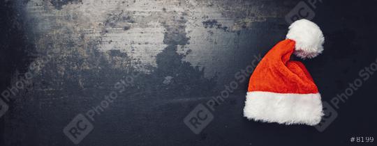christmas santa hat on a dark surface, including copy space  : Stock Photo or Stock Video Download rcfotostock photos, images and assets rcfotostock | RC Photo Stock.: