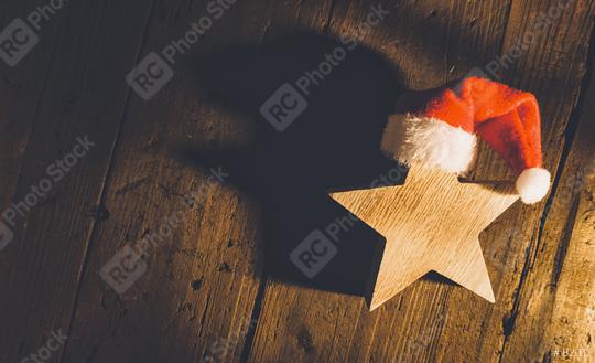 Christmas star with red santa hat on wooden background, including copy space  : Stock Photo or Stock Video Download rcfotostock photos, images and assets rcfotostock | RC Photo Stock.: