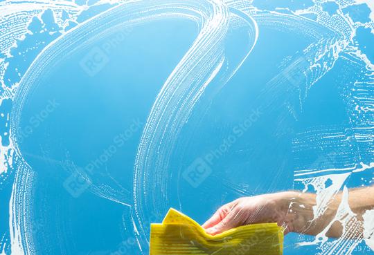 cleaning a glass window with yellow cloth  : Stock Photo or Stock Video Download rcfotostock photos, images and assets rcfotostock | RC Photo Stock.: