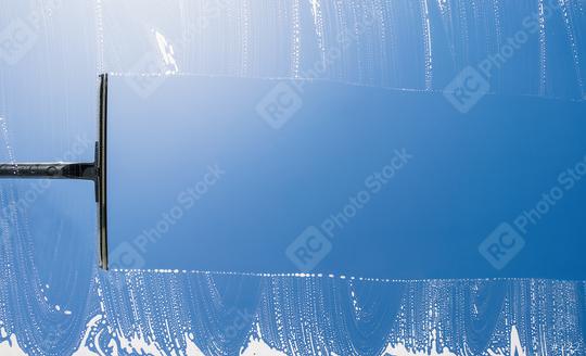 cleaning window with squeegee against blue sky, with copyspace for your individual text.  : Stock Photo or Stock Video Download rcfotostock photos, images and assets rcfotostock | RC Photo Stock.: