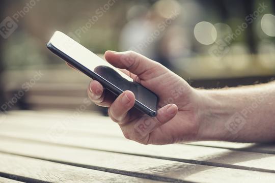 Close up of a man using mobile smart phone  : Stock Photo or Stock Video Download rcfotostock photos, images and assets rcfotostock | RC Photo Stock.: