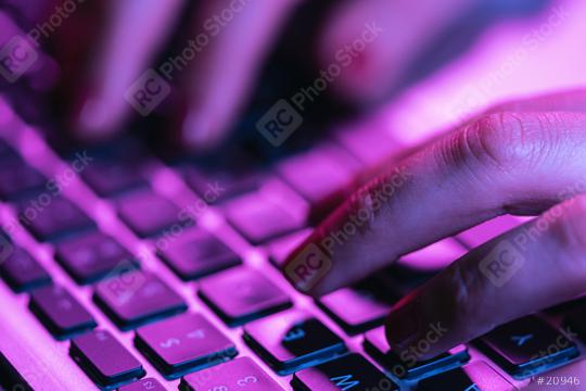 Close up woman hands typing on laptop keyboard, professional online gamer hand fingers on notebook keyboard in neon color, sitting at  gaming desk, woman chatting concept image  : Stock Photo or Stock Video Download rcfotostock photos, images and assets rcfotostock | RC Photo Stock.: