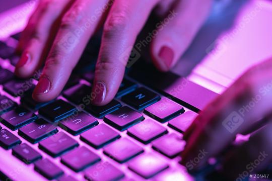 Close up woman hands typing on laptop keyboard, professional online gamer hand fingers on notebook keyboard in neon color, sitting at  gaming desk, woman chatting, browsing apps  : Stock Photo or Stock Video Download rcfotostock photos, images and assets rcfotostock | RC Photo Stock.: