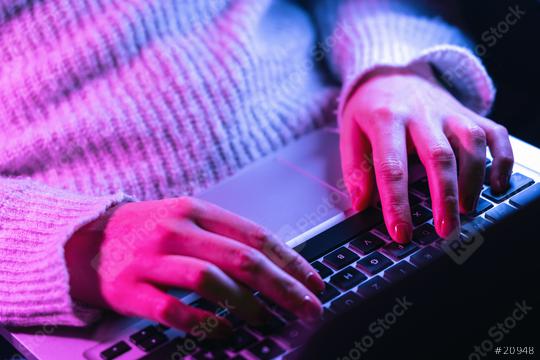 Close up woman hands typing on laptop keyboard, professional online gamer hand fingers on notebook keyboard in neon color, sitting at  gaming desk, woman chatting, browsing apps at home  : Stock Photo or Stock Video Download rcfotostock photos, images and assets rcfotostock | RC Photo Stock.: