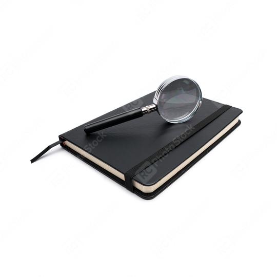 closed black notebook with magnifying glass on white  : Stock Photo or Stock Video Download rcfotostock photos, images and assets rcfotostock | RC Photo Stock.: