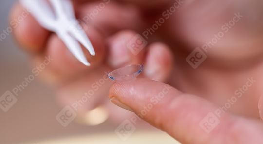 Close-up of a contact lens on a fingertip with a tweezer in the   : Stock Photo or Stock Video Download rcfotostock photos, images and assets rcfotostock | RC Photo Stock.: