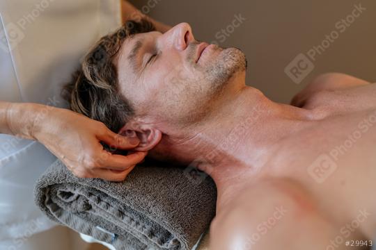 Close-up of a man getting an ear and neck massage at a spa  : Stock Photo or Stock Video Download rcfotostock photos, images and assets rcfotostock | RC Photo Stock.: