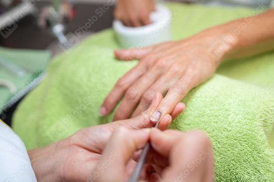 Close-up of a manicure process with a nail file at a beauty salon  : Stock Photo or Stock Video Download rcfotostock photos, images and assets rcfotostock | RC Photo Stock.: