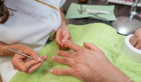 Close-up of a manicure with a manicurist cleaning under a client. body care spa treatment concept image  : Stock Photo or Stock Video Download rcfotostock photos, images and assets rcfotostock | RC Photo Stock.: