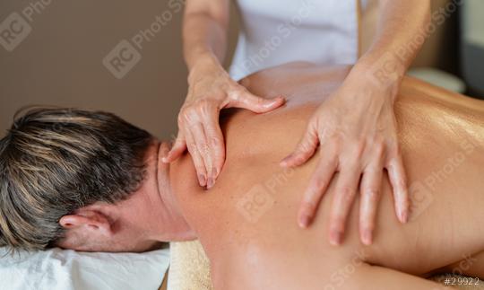 Close-up of a massage therapist working on a client