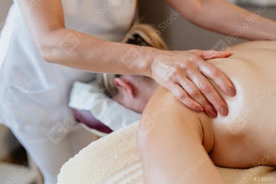 Close-up of a massage therapist working on a client