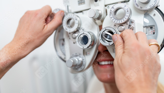 Close-up of a optician adjusting a phoropter for a female patien  : Stock Photo or Stock Video Download rcfotostock photos, images and assets rcfotostock | RC Photo Stock.: