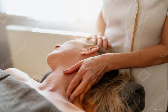 Close-up of a therapist giving a neck and shoulder massage to a woman lying down. beauty salon Wellness Hotel Concept image  : Stock Photo or Stock Video Download rcfotostock photos, images and assets rcfotostock | RC Photo Stock.: