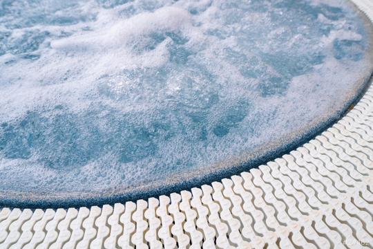 Close-up of bubbling water in a jacuzzi with a textured edge, showcasing a serene spa setting  : Stock Photo or Stock Video Download rcfotostock photos, images and assets rcfotostock | RC Photo Stock.: