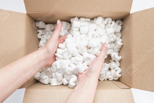 Closeup of female hands digging in a heap of packing peanuts in a Box  : Stock Photo or Stock Video Download rcfotostock photos, images and assets rcfotostock | RC Photo Stock.:
