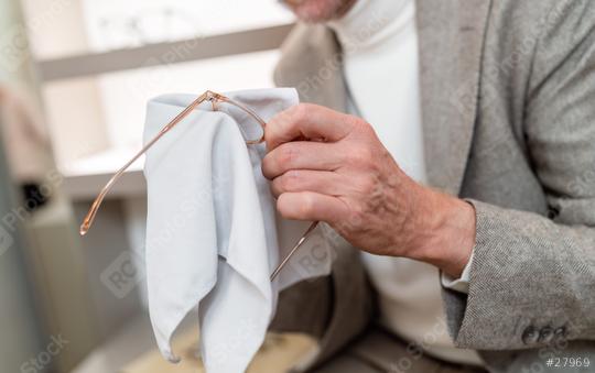 Close-up of hands cleaning glasses with a white cloth. Blurred eyewear display in background
.  : Stock Photo or Stock Video Download rcfotostock photos, images and assets rcfotostock | RC Photo Stock.: