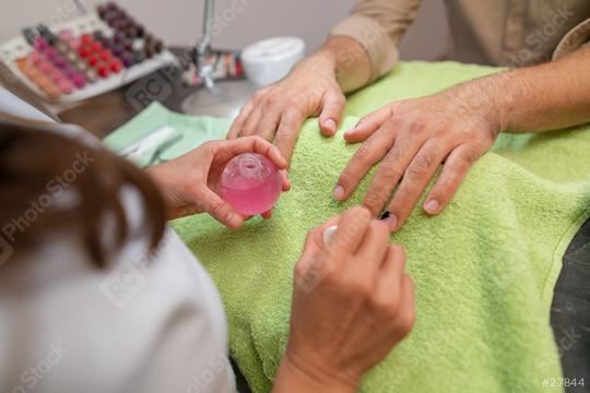 Close-up of nail care by a manicurist applying oil to nails in a beauty salon. body care spa treatment concept image  : Stock Photo or Stock Video Download rcfotostock photos, images and assets rcfotostock | RC Photo Stock.: