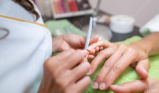 Close-up of nail filing process in a salon with manicurist and client
.  : Stock Photo or Stock Video Download rcfotostock photos, images and assets rcfotostock | RC Photo Stock.: