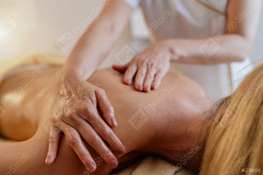 Close-up of therapeutic hands massaging a client