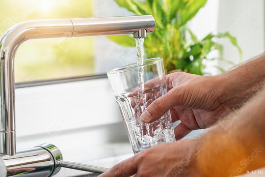 Closeup shot of a man pouring a glass of fresh water from a kitchen faucet  : Stock Photo or Stock Video Download rcfotostock photos, images and assets rcfotostock | RC Photo Stock.: