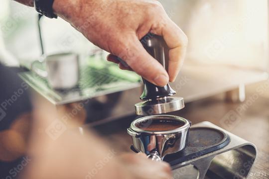 Coffee flour just pressed into filter holder by a Barista for fresh espresso coffee  : Stock Photo or Stock Video Download rcfotostock photos, images and assets rcfotostock | RC Photo Stock.: