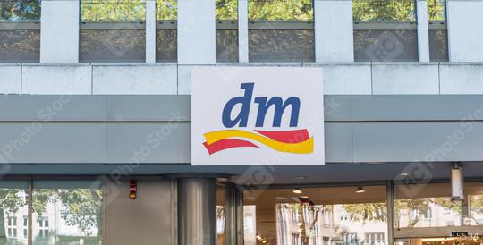 COLOGNE, GERMANY OCTOBER, 2017: Dm drogeriemarkt sign. Headquartered in Karlsruhe, Dm-drogerie markt is a chain of retail drugstore chain for cosmetics, healthcare and household products and food.  : Stock Photo or Stock Video Download rcfotostock photos, images and assets rcfotostock | RC Photo Stock.: