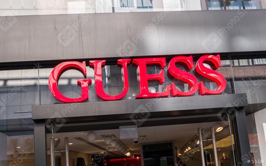 COLOGNE, GERMANY OCTOBER, 2017: Guess logo on a store front. Guess is an American upscale clothing line brand popular with its brand of jeans.  : Stock Photo or Stock Video Download rcfotostock photos, images and assets rcfotostock | RC Photo Stock.: