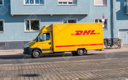 COLOGNE, GERMANY OCTOBER, 2017: Yellow DHL parcel delivery truck parked on the street. DHL Express is a division of the German worldwide logistics company.  : Stock Photo or Stock Video Download rcfotostock photos, images and assets rcfotostock | RC Photo Stock.: