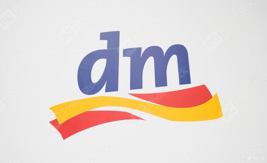 COLOGNE, GERMANY SEPTEMBER, 2017: Dm drogeriemarkt logo. Headquartered in Karlsruhe, Dm-drogerie markt is a chain of retail drugstore chain for cosmetics, healthcare and household products and food.  : Stock Photo or Stock Video Download rcfotostock photos, images and assets rcfotostock | RC Photo Stock.: