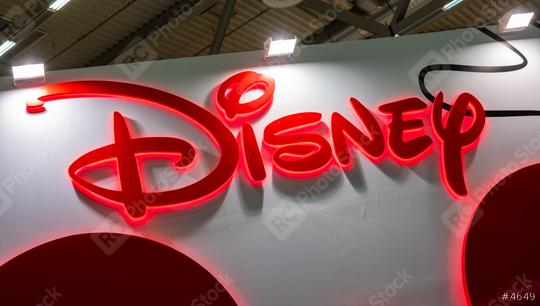 COLOGNE, GERMANY SEPTEMBER, 2019: Disney company logo sign at a trade show. The Walt Disney Company, commonly known as Disney, is an American mass media and entertainment company  : Stock Photo or Stock Video Download rcfotostock photos, images and assets rcfotostock | RC Photo Stock.: