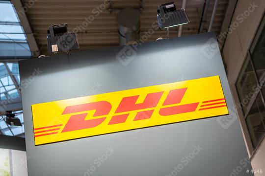 COLOGNE, GERMANY SEPTEMBER, 2019: Logo of DHL on a trade show booth. DHL is a division of the German logistics company.  : Stock Photo or Stock Video Download rcfotostock photos, images and assets rcfotostock | RC Photo Stock.: