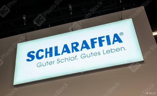 COLOGNE, GERMANY SEPTEMBER, 2019: Schlaraffia logo sign at a trade show booth. Schlaraffia is the traditional brand in the field of sleep systems.   : Stock Photo or Stock Video Download rcfotostock photos, images and assets rcfotostock | RC Photo Stock.: