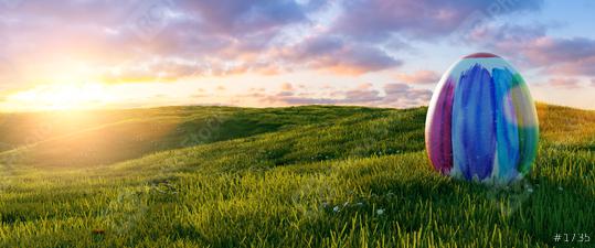 colorful big painted easter egg at easter on sunrise or sunset on a meadow landscape, Panoramic backgroud, with copyspace for your individual text.  : Stock Photo or Stock Video Download rcfotostock photos, images and assets rcfotostock | RC Photo Stock.: