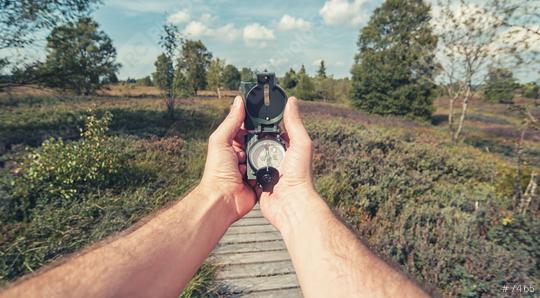 Compass in the hand on the nature background  : Stock Photo or Stock Video Download rcfotostock photos, images and assets rcfotostock | RC Photo Stock.: