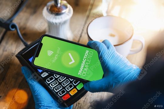 contactless payment on a mobile phone. Close up of a woman hand paying contactless with a smartphone screen application. Hand holding smart device to pay. Mockup cellphone screen.  : Stock Photo or Stock Video Download rcfotostock photos, images and assets rcfotostock | RC Photo Stock.: