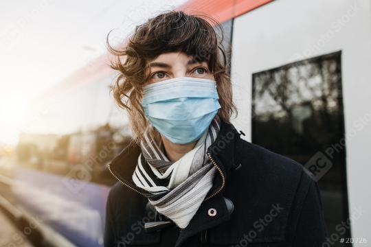 Corona virus, COVID-19. Young german woman with medical face mask to protect against the coronavirus on a train station at the subway platform. Mouth protection. Pandemic Germany  : Stock Photo or Stock Video Download rcfotostock photos, images and assets rcfotostock | RC Photo Stock.:
