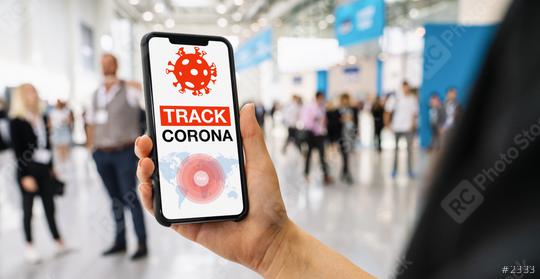 coronavirus tracker app on a mobile smartphone. Close up of woman tracking crowd of people in a smartphone screen application. Hand holding smart device. Mockup website. covid-19 corona virus tracker  : Stock Photo or Stock Video Download rcfotostock photos, images and assets rcfotostock | RC Photo Stock.: