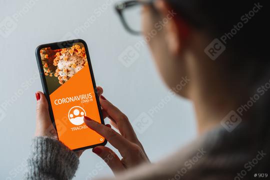 coronavirus tracking app on a mobile smartphone. Close up of woman tracking crowd of people in a smartphone screen application. Hand holding smart device. Mockup website. covid-19 corona virus tracker  : Stock Photo or Stock Video Download rcfotostock photos, images and assets rcfotostock | RC-Photo-Stock.: