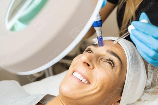 cosmetologist making mesotherapy injection with dermapen on face for rejuvenation on the cosmetology salon.   : Stock Photo or Stock Video Download rcfotostock photos, images and assets rcfotostock | RC Photo Stock.: