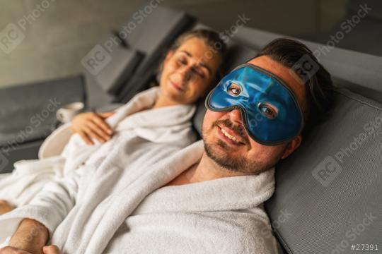 Couple relaxing in spa, man with blue gel cooling mask, woman in background  : Stock Photo or Stock Video Download rcfotostock photos, images and assets rcfotostock | RC Photo Stock.: