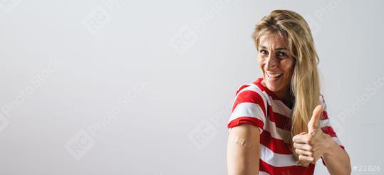 Covid-19 Coronavirus Vaccinated happy Woman Showing her Arm With Plaster and Thump up, copyspace for your individual text.  : Stock Photo or Stock Video Download rcfotostock photos, images and assets rcfotostock | RC Photo Stock.: