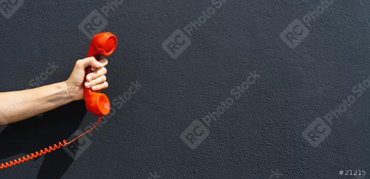 Cropped Hand Of Woman Holding Telephone Receiver Against Black Wall, with copy space for individual text  : Stock Photo or Stock Video Download rcfotostock photos, images and assets rcfotostock | RC Photo Stock.: