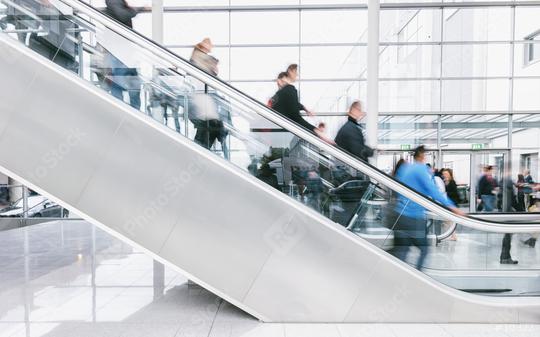 crowd of blurred people rushing on escalators at a trade fair hall  : Stock Photo or Stock Video Download rcfotostock photos, images and assets rcfotostock | RC Photo Stock.: