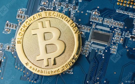cryptocurrency Bitcoin on a Mother board  : Stock Photo or Stock Video Download rcfotostock photos, images and assets rcfotostock | RC Photo Stock.: