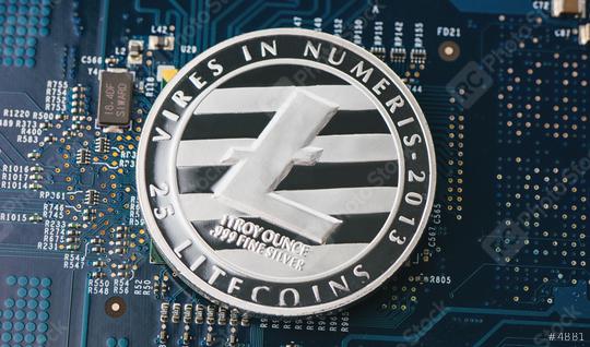 Cryptocurrency physical silver litecoin coin on motherboard  : Stock Photo or Stock Video Download rcfotostock photos, images and assets rcfotostock | RC Photo Stock.: