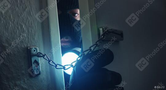 dangerous masked stalker sneaking into the house with a torch  : Stock Photo or Stock Video Download rcfotostock photos, images and assets rcfotostock | RC Photo Stock.: